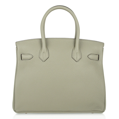 Soft Muted Sage Green Gentle Pebbled Grain Medium Structured Hand Tote With Luminous Golden Twist Lock Hardware And Coordinating Sage Suspended Metal Padlock Charm