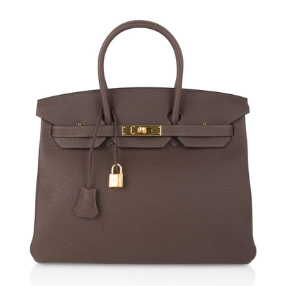 Rich Deep Chocolate Brown Soft Uniform Pebbled Grain Spacious Structured Hand Tote With Polished Golden Twist Lock Hardware And Coordinating Brown Suspended Metal Padlock Charm