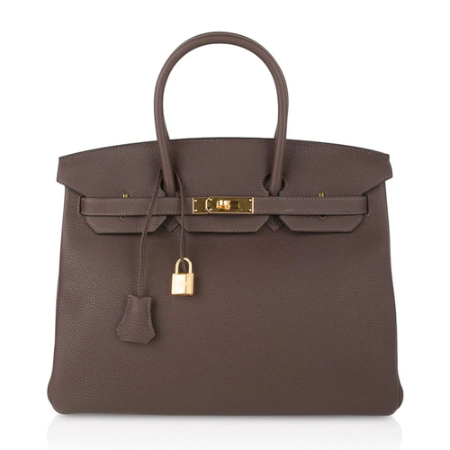 Rich Deep Chocolate Brown Soft Uniform Pebbled Grain Spacious Structured Hand Tote With Polished Golden Twist Lock Hardware And Coordinating Brown Suspended Metal Padlock Charm