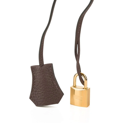 Rich Deep Chocolate Brown Soft Uniform Pebbled Grain Spacious Structured Hand Tote With Polished Golden Twist Lock Hardware And Coordinating Brown Suspended Metal Padlock Charm